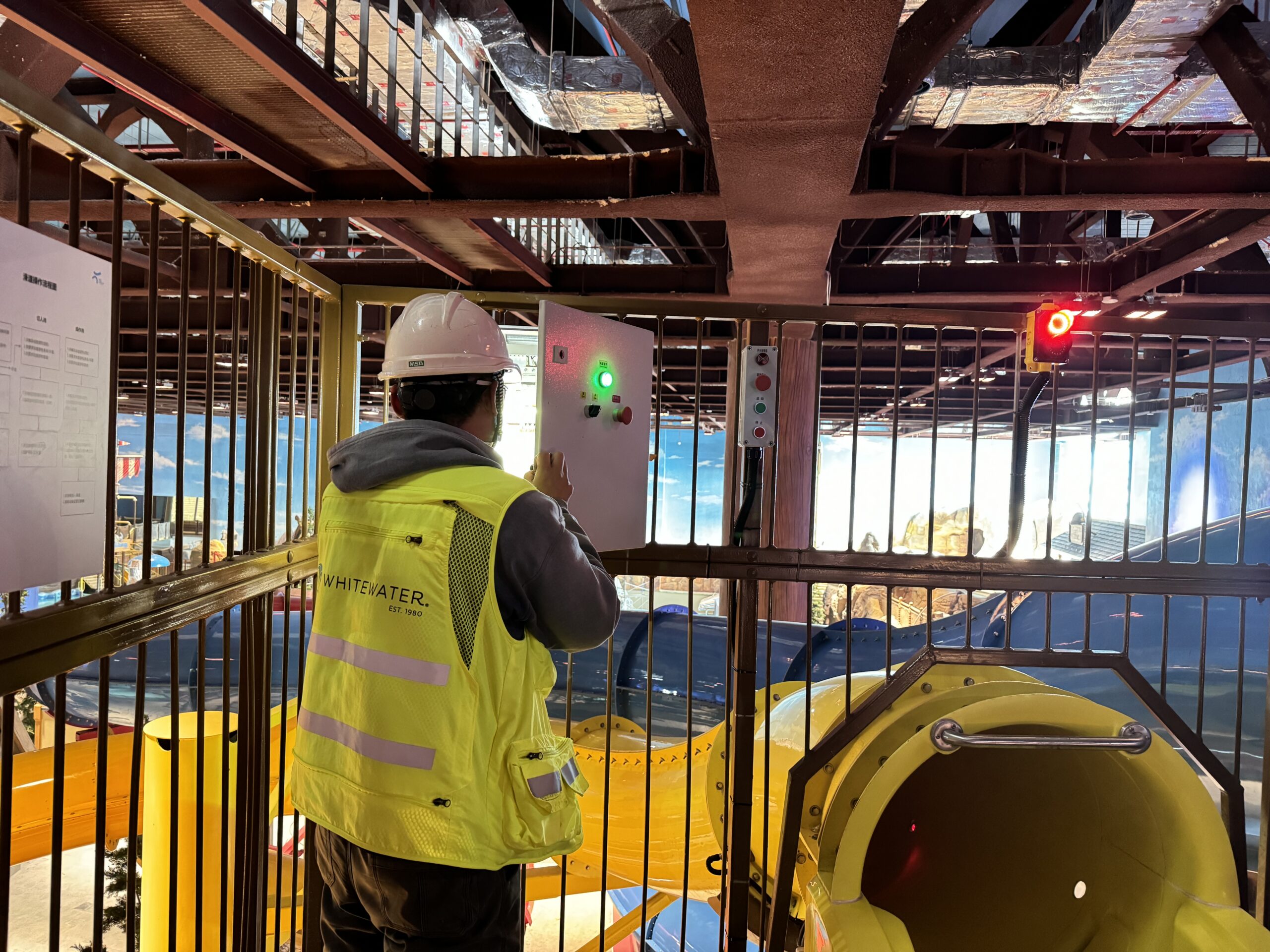 Man looking at water slide controls