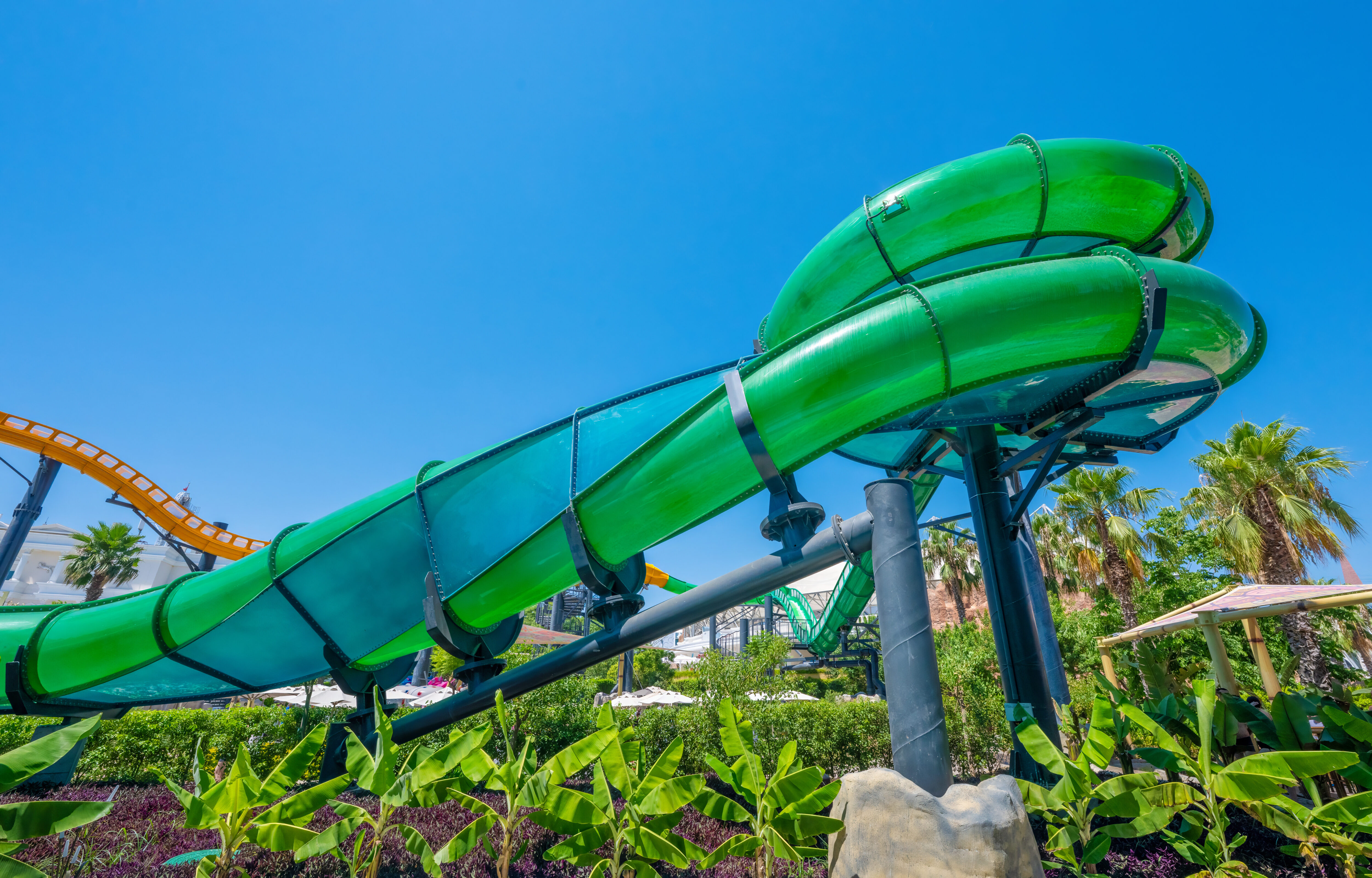 An oval green water slide flume