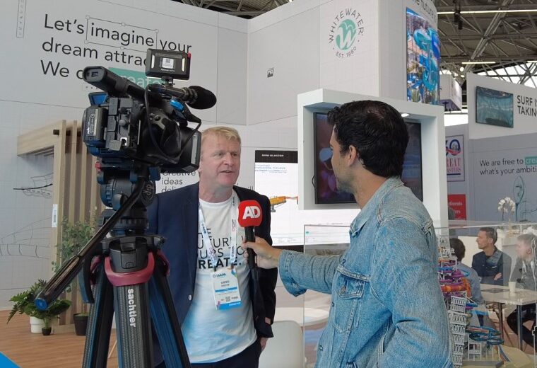 A man being interviewed by a reporter