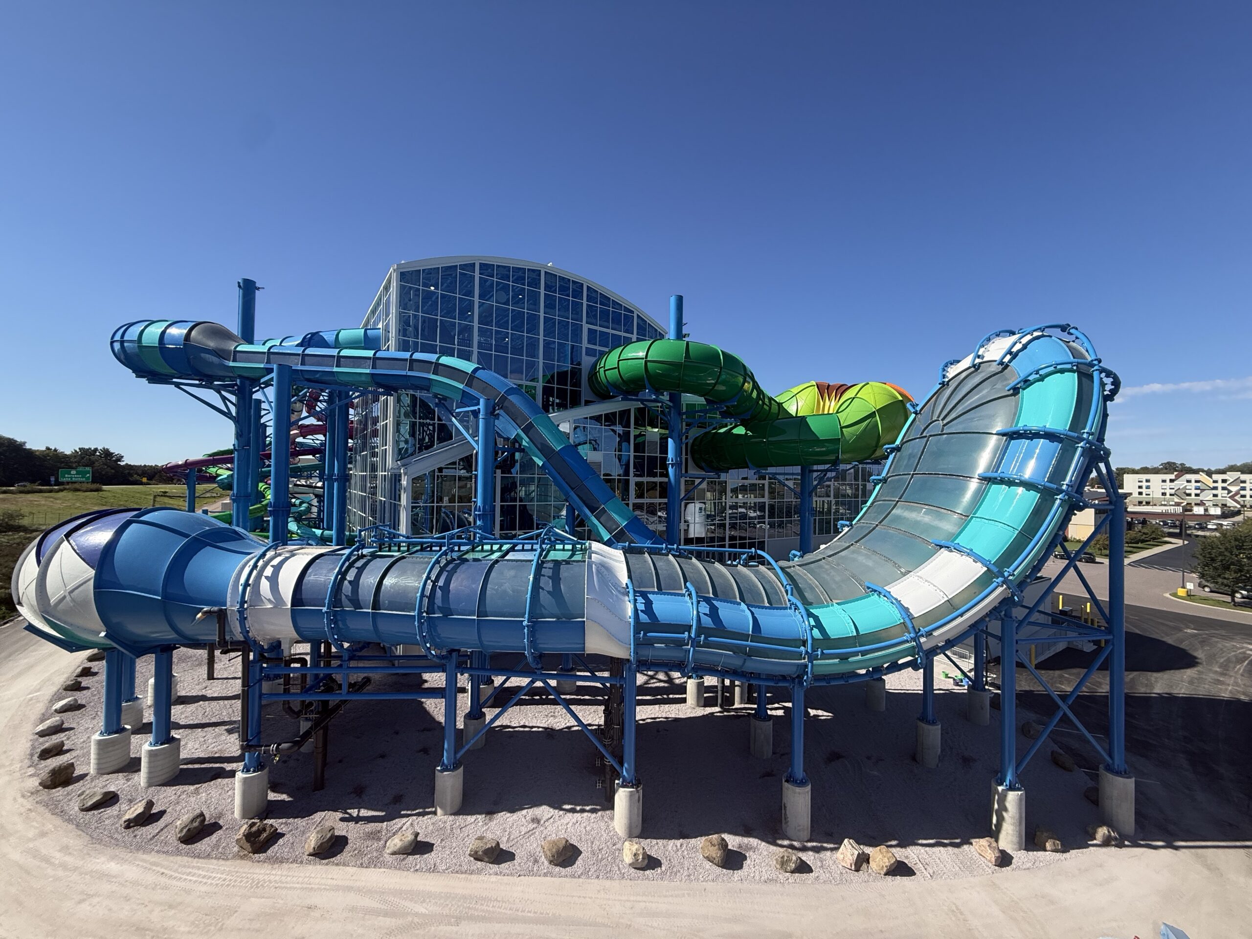 A covered wall ride outside an indoor water park