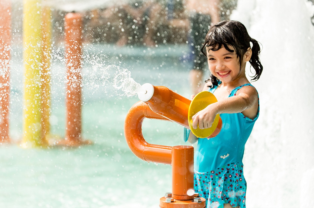 A kid having fun with AquaSpray in an AquaPlay Structure by WhiteWater West - Sunway Lagoon, Malaysia