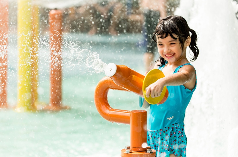 A kid having fun with AquaSpray in an AquaPlay Structure by WhiteWater West - Sunway Lagoon, Malaysia