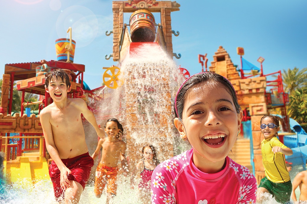 Kids playing at a Rain Forest, AquaPlay Structure by WhiteWater West