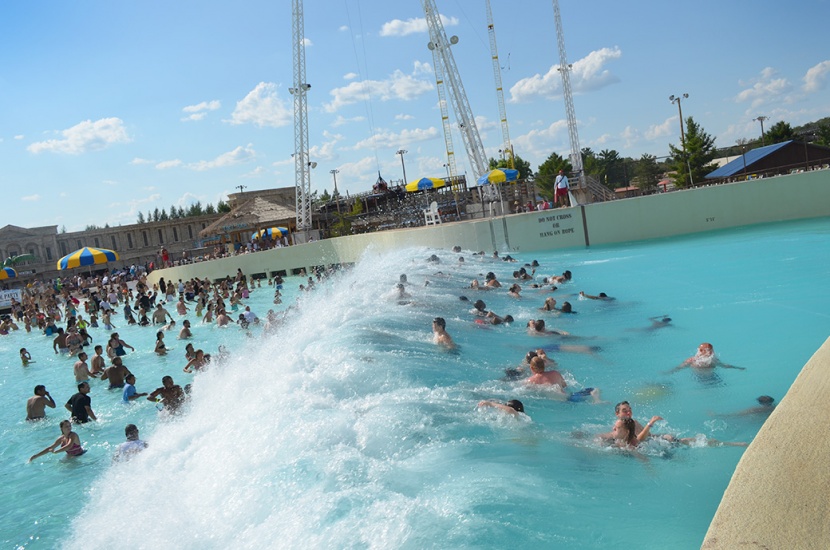 People having fun at the best Surf Wave Pool by WhiteWater West at Mt Olympus Waterpark, WI, USA