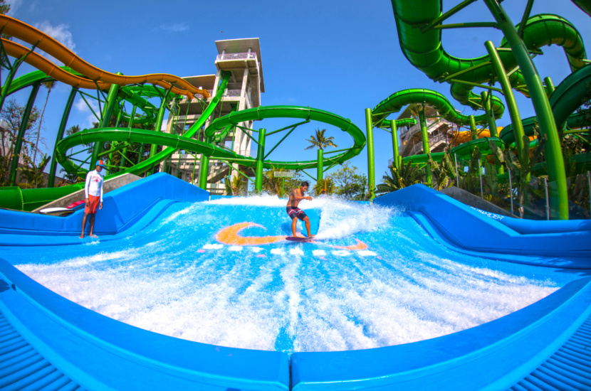 Having fun surfing at the best FlowRider Double by WhiteWater West, Waterbom Bali