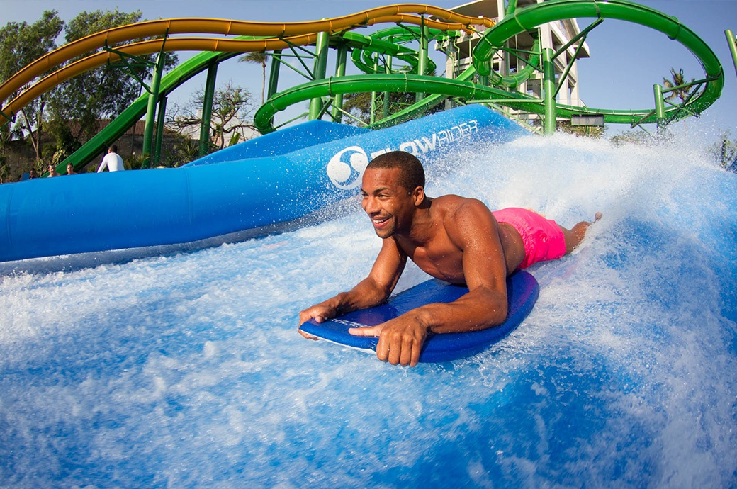 Having fun surfing at the best FlowRider Double by WhiteWater West at Waterbom Bali Kuta Bali