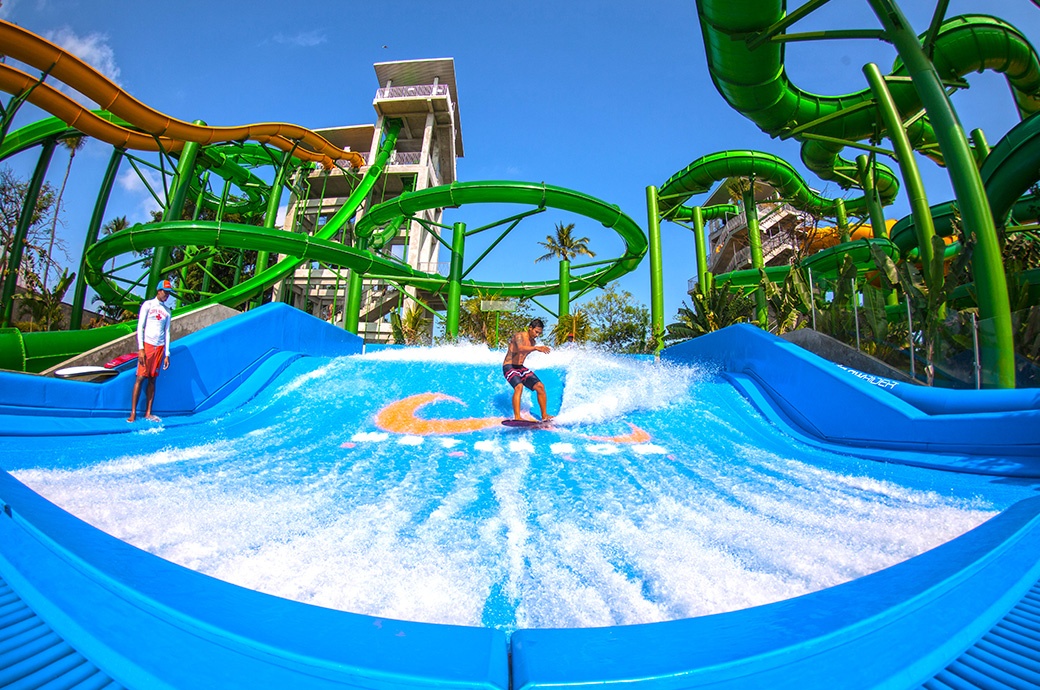 Having fun surfing at the best FlowRider Double by WhiteWater West at Waterbom Bali Kuta Bali