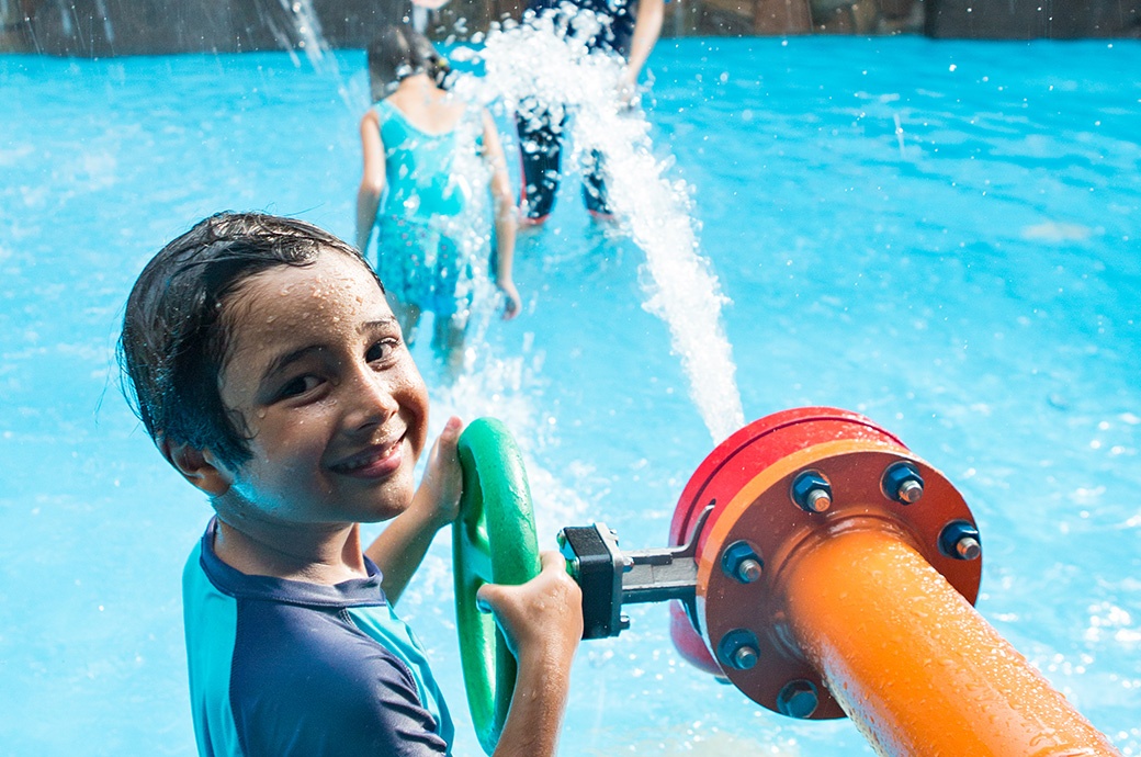 A kid having fun with AquaSpray in an AquaPlay Structure by WhiteWater West - Sunway Lagoon, Malaysia