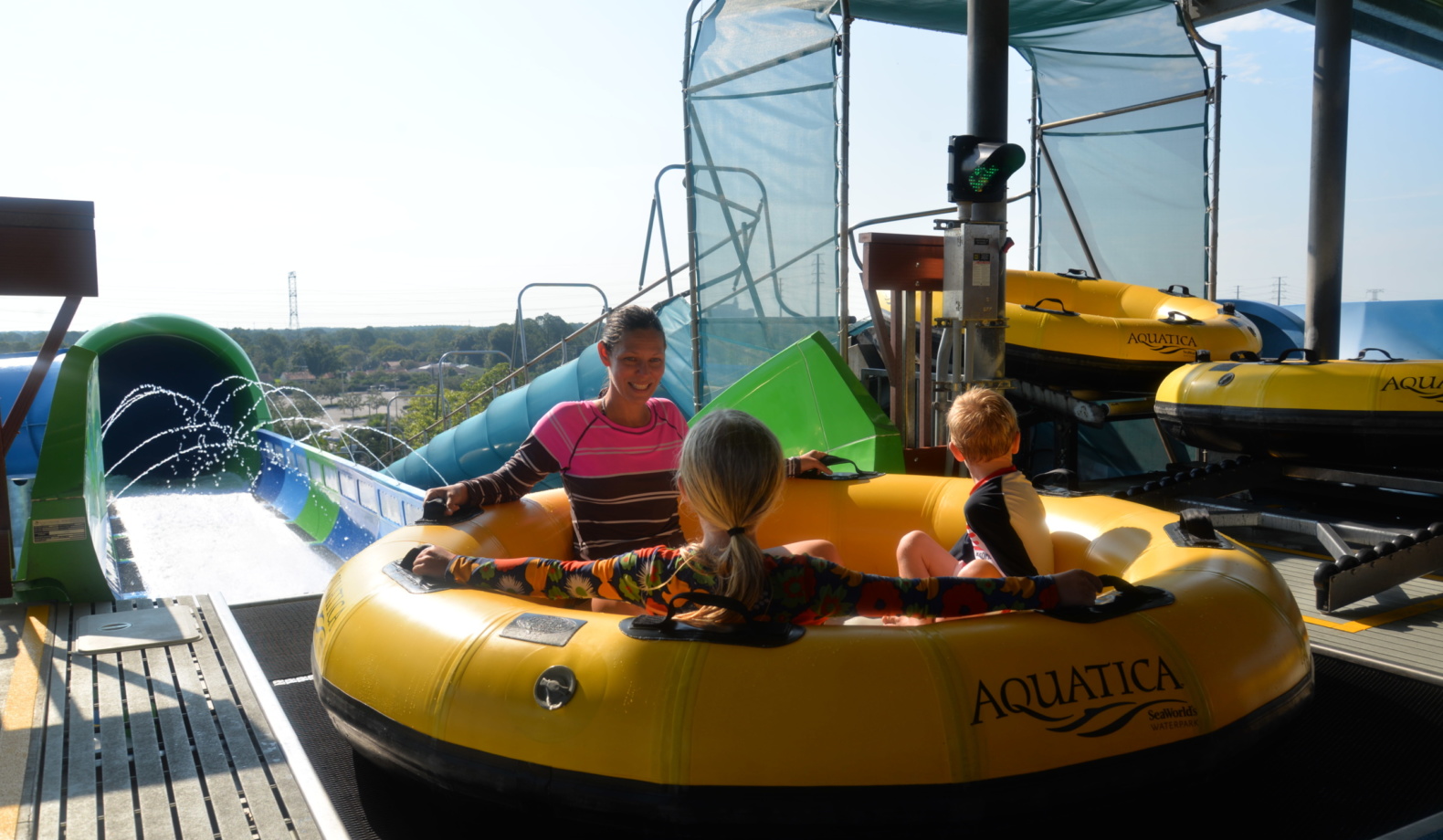 Family having fun at a safe raft water ride by the best water slide manufacturer - WhiteWater West