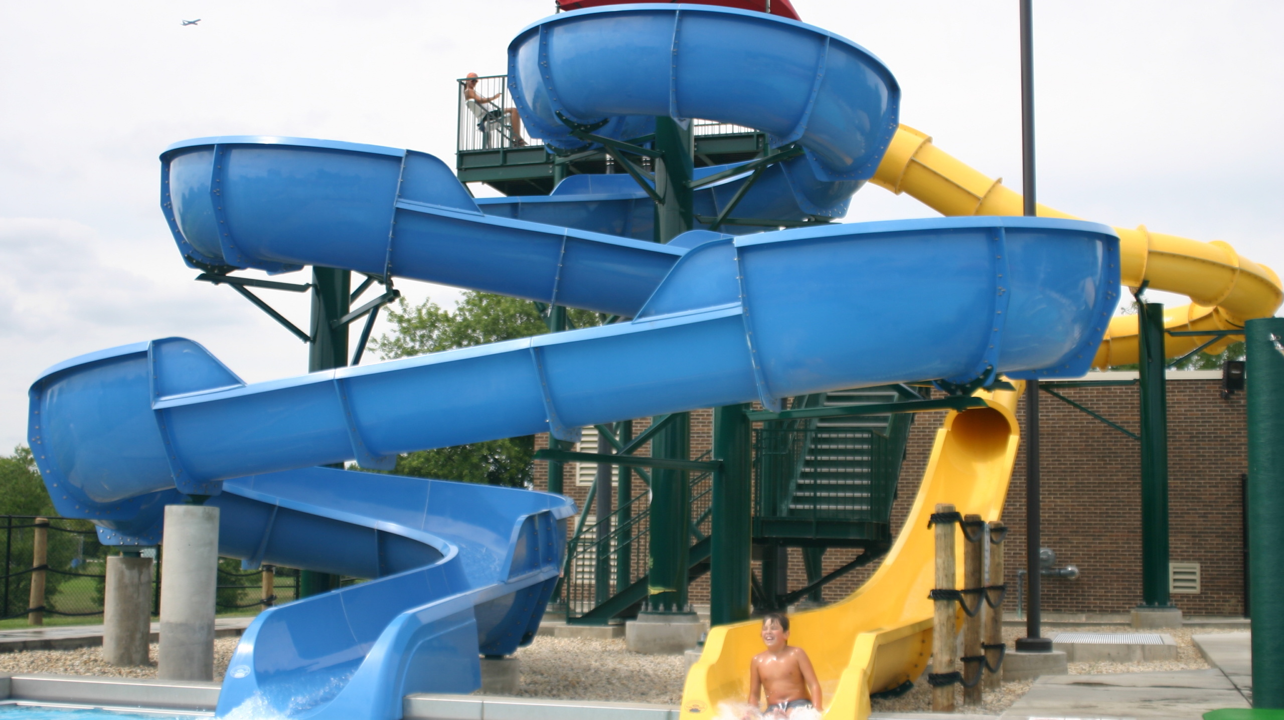 Two mini blue and yellow slides for children