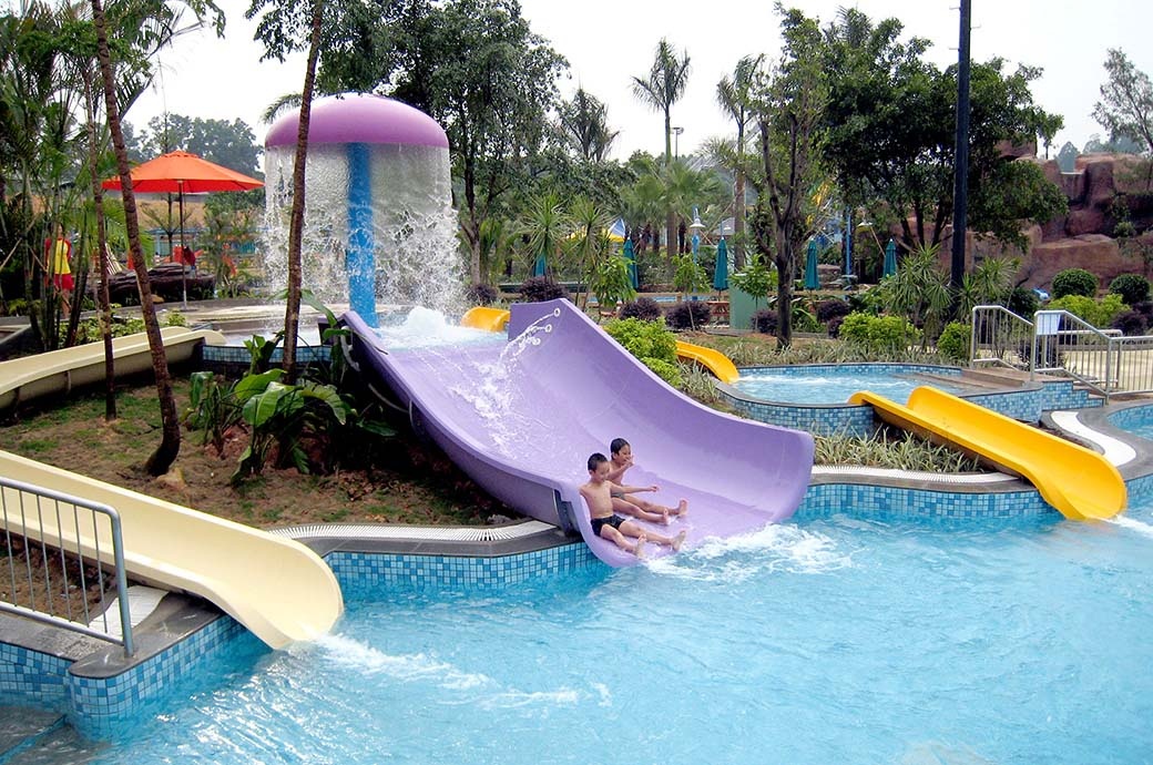 Kids having fun at the best Mini Body Slides for Kids, Kids Water slides by WhiteWater West - Chimelong Waterpark, Guangzhou, China