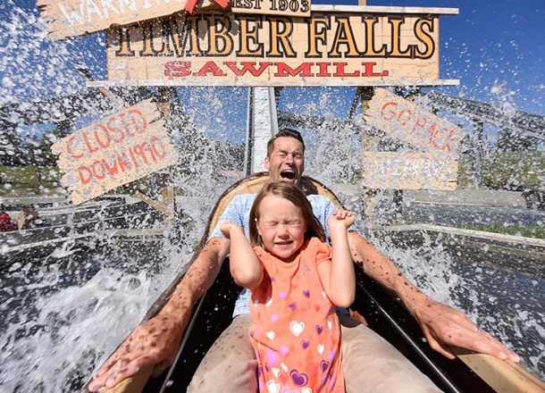 Family having fun at the best Log Flume Ride - Water Ride by WhiteWater West - Calaway Park, AB, Canada