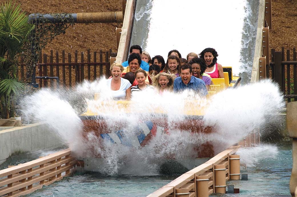 People having fun at the Shoot the Chute - the best Water Ride by WhiteWater West - Legoland, CA, USA