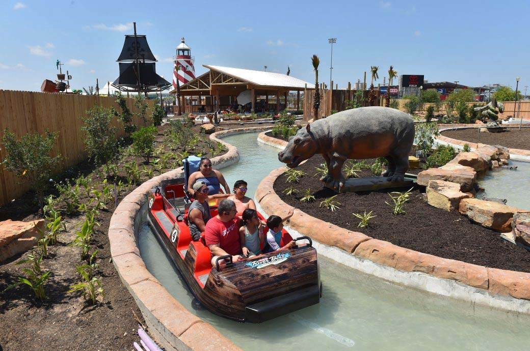 Family having fun at the Water Transportation best Water Ride by WhiteWater West – Morgan’s Inspiration Island, San Antonio, Texas, US