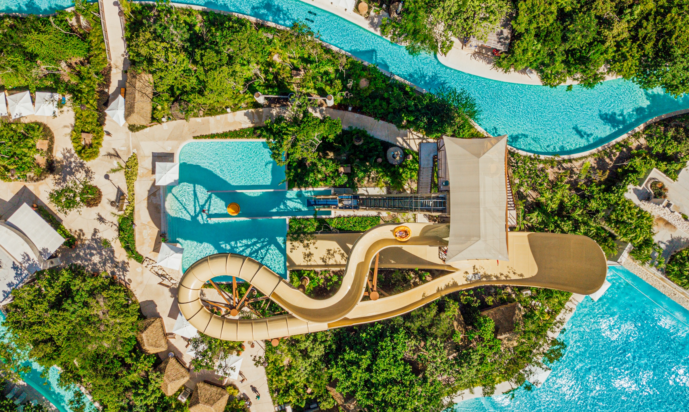 water slide and tower in lush green from bird's eye view