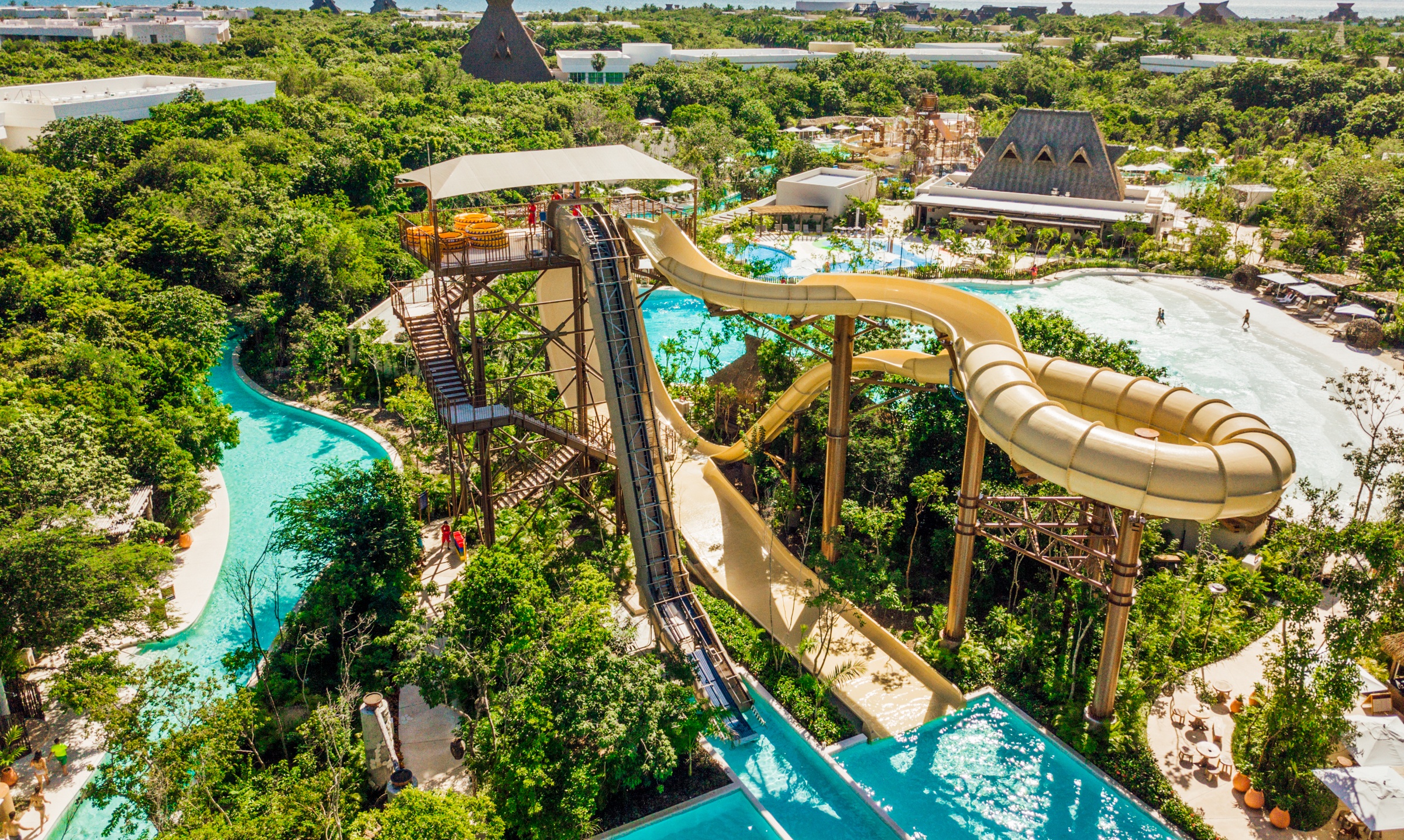 water slide tower in lush green