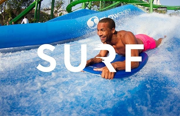 Excited young man on Flowrider
