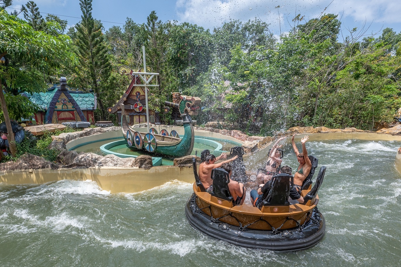 People in a river raft ride