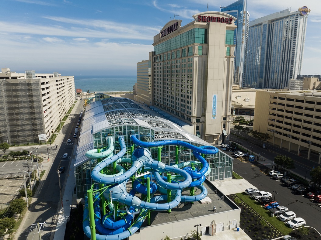 Outside view of an indoor water park from above with protruding water slides