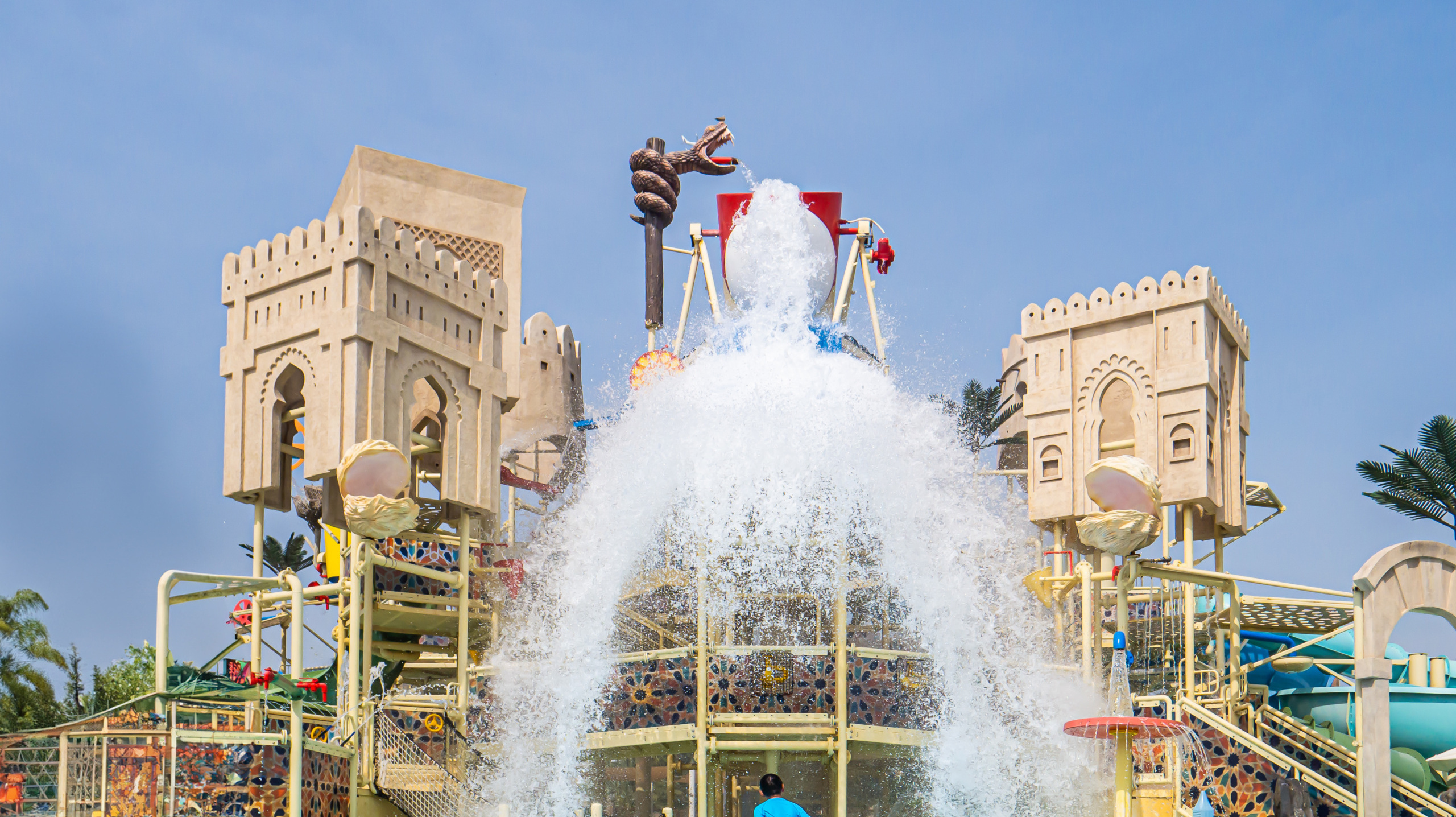 Tipping bucket with water spills onto an aquatic play area